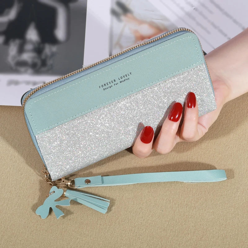 Long women's wallet in glittery PU leather with zip, wrist strap, and elegant large capacity